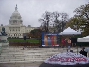 Director Moy and othe dignitaries standing in front of the Capitol Dome